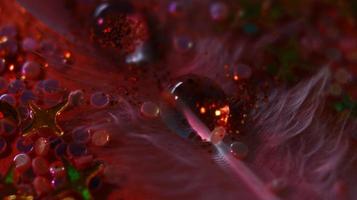 Close-up Of water drop with glitter on it in different colorful loghts in Karachi Pakistan 2022 photo