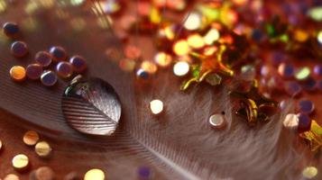 Close-up Of water drop with glitter on it in different colorful loghts in Karachi Pakistan 2022 photo