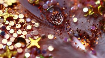 Close-up Of water drop with glitter on it in different colorful loghts in Karachi Pakistan 2022 photo