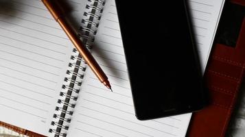 Work Bag And Office Diary On Table in Karachi Pakistan 2022 photo