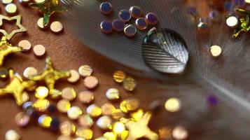 Close-up Of water drop with glitter on it in different colorful loghts in Karachi Pakistan 2022 photo
