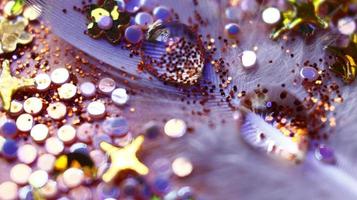 Close-up Of water drop with glitter on it in different colorful loghts in Karachi Pakistan 2022 photo