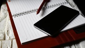 Work Bag And Office Diary On Table in Karachi Pakistan 2022 photo