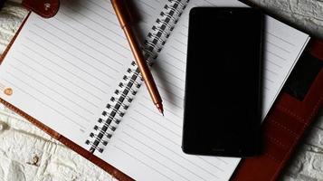Work Bag And Office Diary On Table in Karachi Pakistan 2022 photo