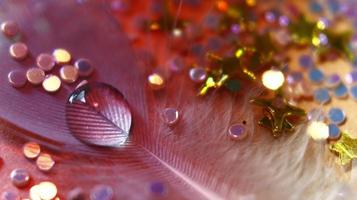 Close-up Of water drop with glitter on it in different colorful loghts in Karachi Pakistan 2022 photo