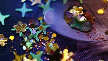 Close-up Of water drop with glitter on it in different colorful loghts in Karachi Pakistan 2022 photo
