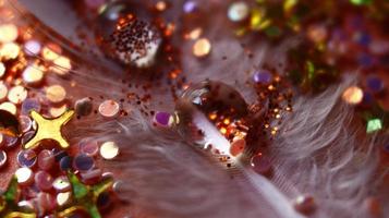 Close-up Of water drop with glitter on it in different colorful loghts in Karachi Pakistan 2022 photo