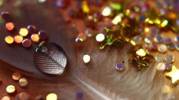 Close-up Of water drop with glitter on it in different colorful loghts in Karachi Pakistan 2022 photo