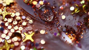 Close-up Of water drop with glitter on it in different colorful loghts in Karachi Pakistan 2022 photo
