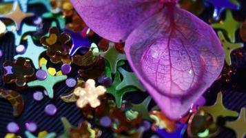 Close-up Of water drop with glitter on it in different colorful loghts in Karachi Pakistan 2022 photo