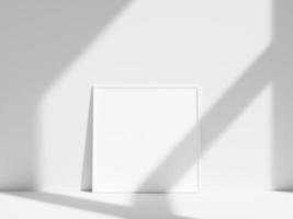 Empty frame on the white wall with window shadow photo