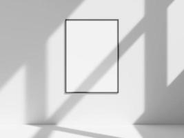 Empty frame on the white wall with window shadow photo