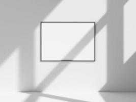 Empty frame on the white wall with window shadow photo