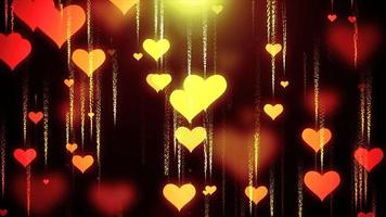 Festive yellow gold love background of flying down hearts with blur and glow effect and particles for Valentine's Day. Abstract background. Video in high quality 4k, motion design