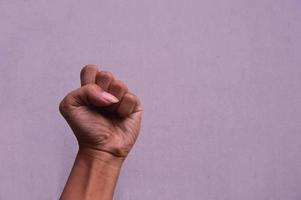 fist clenched against a white background photo