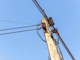 The complex electric wire on the concrete pole. photo