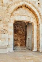 View of the Jaffa Gate in Jerusalem. The old gate has the shape of a medieval gate tower with an L-shaped entryway, which was secured at both ends with heavy doors photo