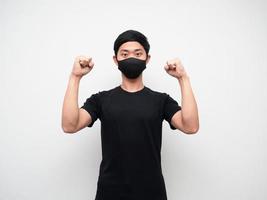 Asian man with mask show double fist up confident face on white background photo