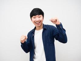 Portrait asian man dancing funny emotion happy at face white background photo