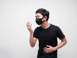 Sick man with mask black shirt cough on white isolated space photo