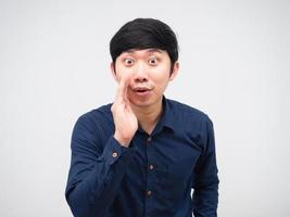 Asian man whisper at you hand up at his mouth portrait white background photo