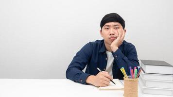 Man sitting at workplace desk gesture bored to working photo