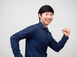 Portrait asian man run gesture happy smile face white background photo