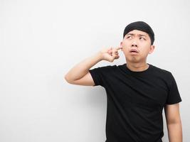 Asian man gesture deaf and looking at copy space tinnisus concept photo