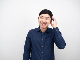 Asian man touch his head shy emotion white background portrait photo