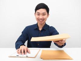 Asian man give document envolope to you happy emotion and smile face photo