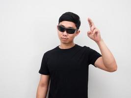 Man wearing sunglasses motion hand white background photo