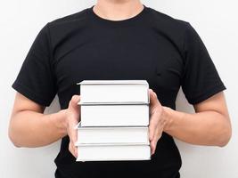 Close up man holding books in hand crop shot portrait photo