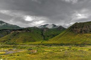 Hilly landscape near the village of Gergeti in Georgia, under Mount Kazbegi. photo