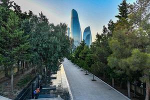 Martyr Alley and Flame Towers of the city of Baku, Azerbaijan at dusk. photo