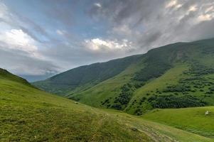 Hilly landscape near the village of Gergeti in Georgia, under Mount Kazbegi. photo