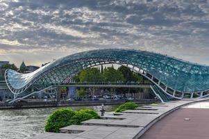 The Bridge of Peace in Tbilisi, a pedestrian bridge over the Mtkvari River in Tbilisi, Georgia. photo