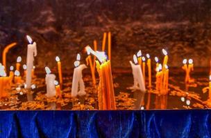 Lit candles burning in old Sevanavank church in Sevan,  Armenia. photo