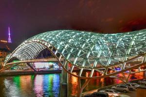 The Bridge of Peace in Tbilisi, a pedestrian bridge over the Mtkvari River in Tbilisi, Georgia. photo