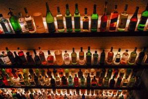 Buenos Aires, Argentina - May 22, 2007 -  Several types of bottled alcohol and liquor are displayed on some shelves in a pub. photo