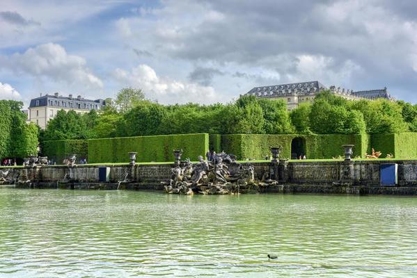 Neptune pool in the famous Palace of Versailles in France.
