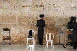 Traditional Hassidic Man Praying at the Western Wall photo