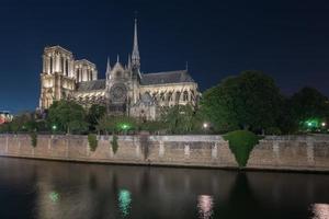 Notre-Dame de Paris, is a French Gothic medieval Catholic cathedral on the Ile de la Cite in the fourth arrondissement of Paris, France. photo