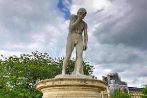 Statue in Tuileries Garden in Paris, France. It is one of the oldest and most popular places in the center of Paris in the 1st district, on the right bank of Seine. photo