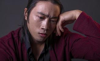 handsome asian fashion looking man posing in studio on black background, lifestyle modern people concept photo