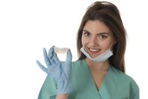 Invisible orthodontics cosmetic aligners in hands of doctor photo