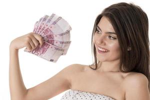 Beautiful woman holding bunch of 500 euro banknotes photo