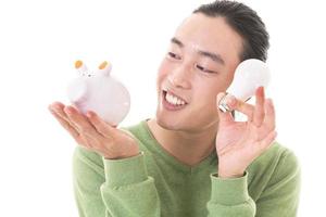 businessman makes savings puts coins lifestyle in a piggy bank. piggy bank business concept photo