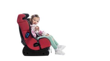 A little girl in a car seat photo