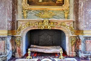 Fireplace in the famous Palace of Versailles in France, 2022 photo