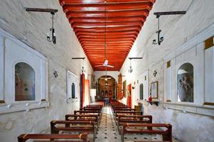 Campeche, Mexico - May 26, 2021 -  The beautiful yellow church of San Roque in the walled colonial city of Campeche, Mexico. photo